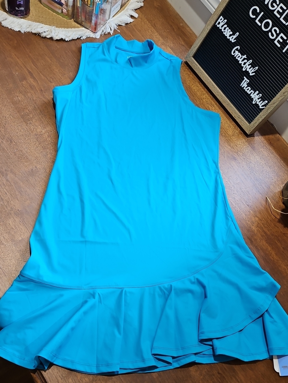 Mock Neck, Sleeveless Ruffle-Hem Mini Dress in Bright Turquoise